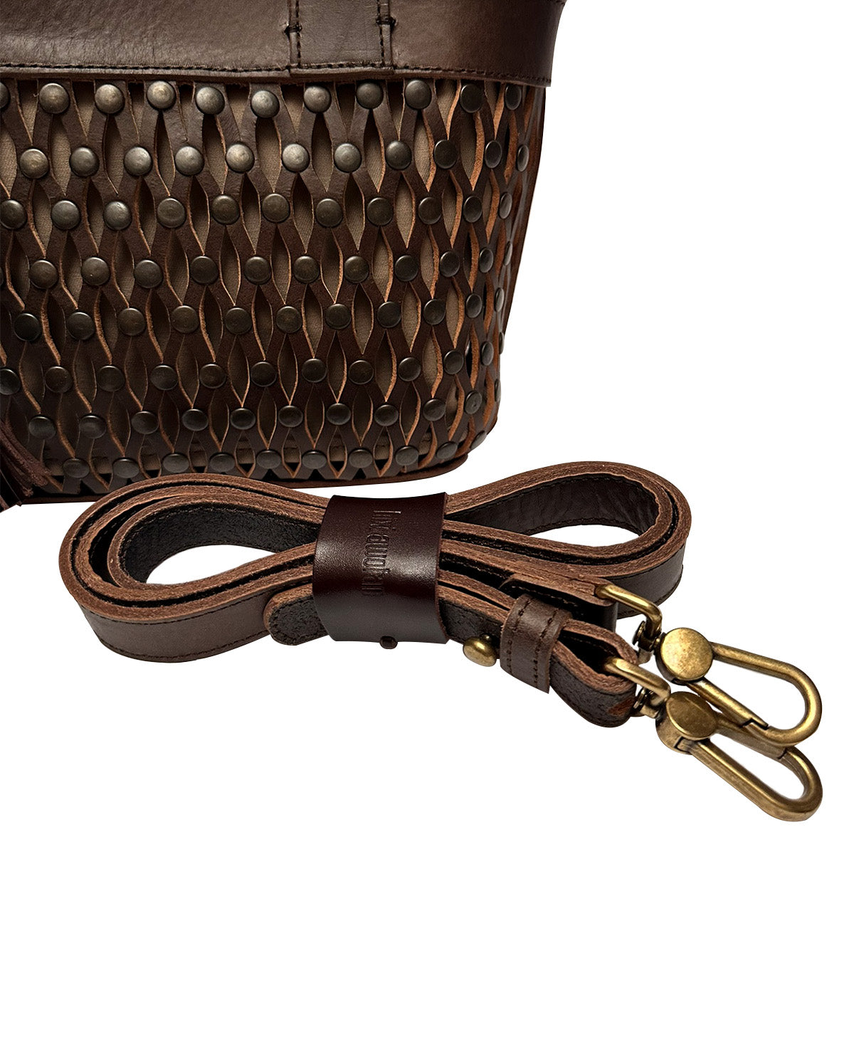 Handcrafted artisan stitching on the Studded Mini Tulum brown leather handbag.