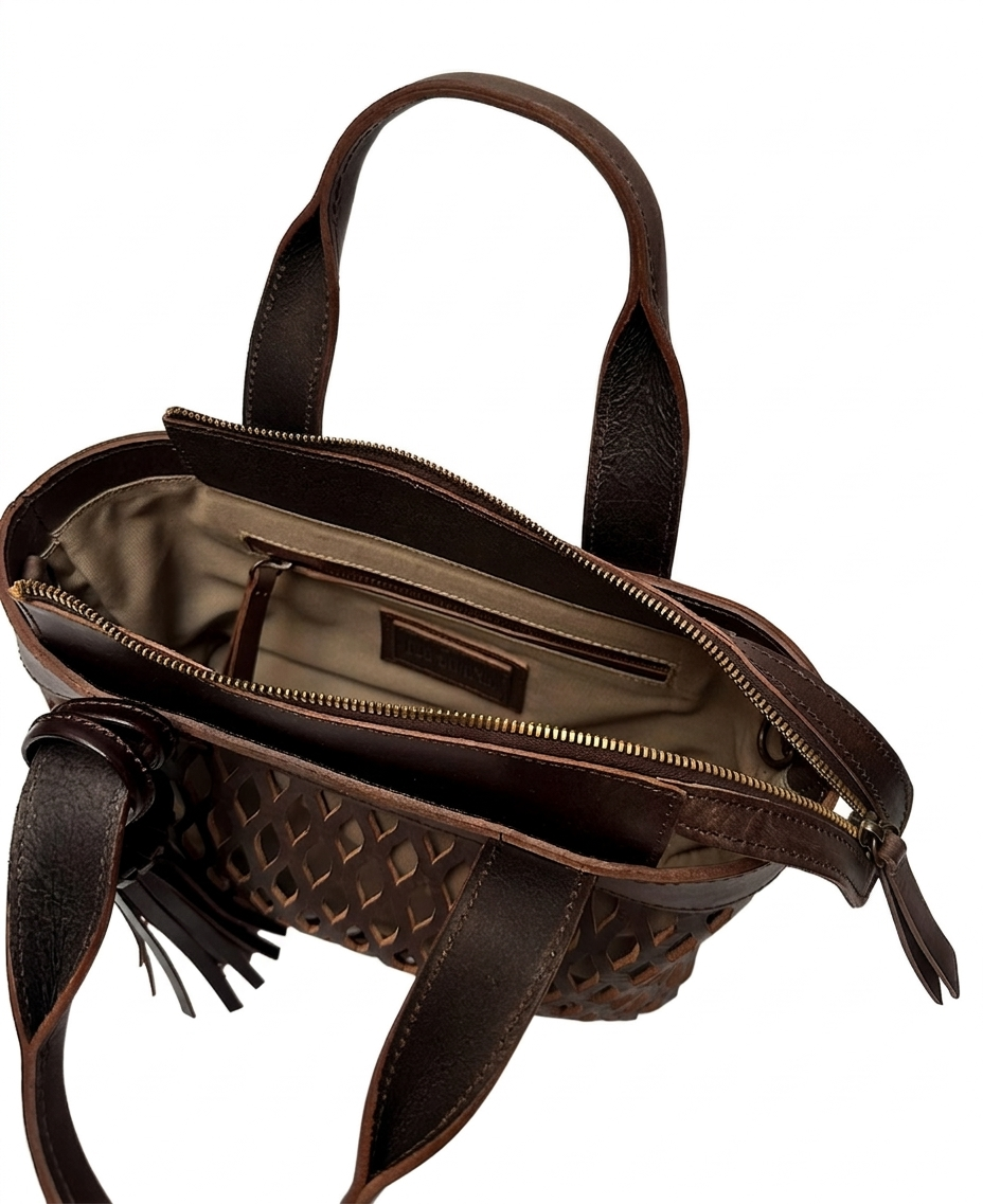 Mocha brown leather mini bag featuring its adjustable and removable long strap for crossbody wear.